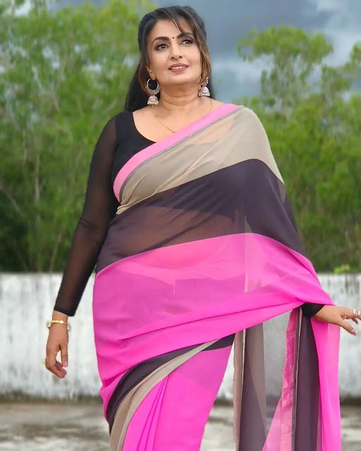 Maya Viswanath looking radiant in a pink saree, embodying timeless grace and sophistication.