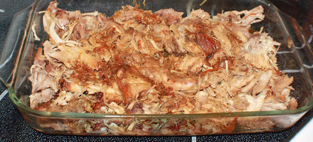 oven baked barbecued chicken pulled in a baking dish