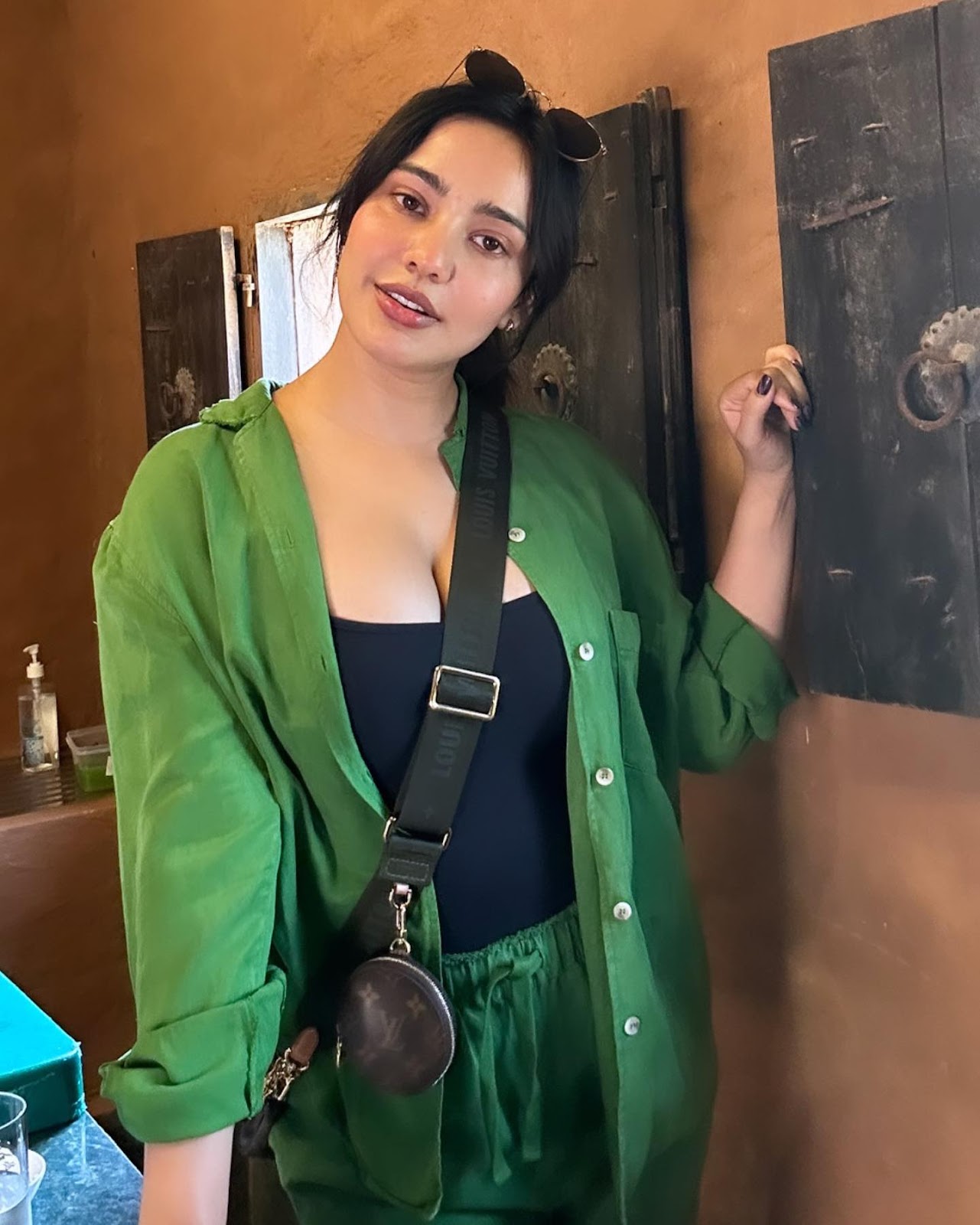 neha sharma cleavage black top green shirt