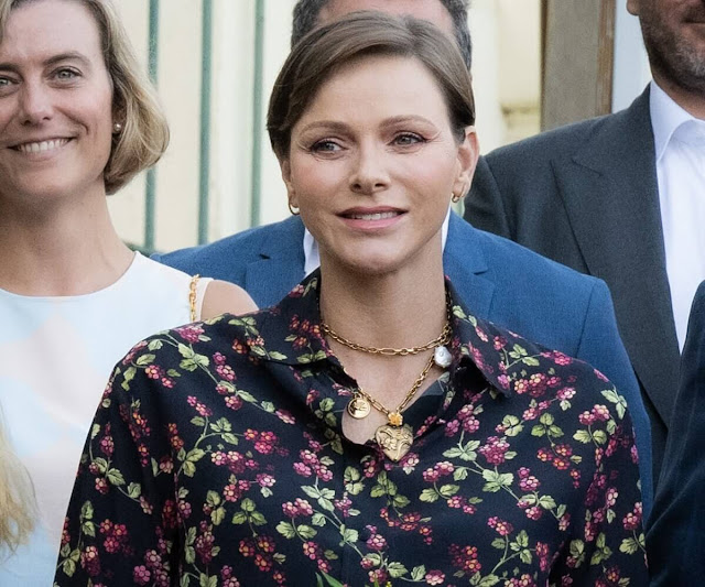 Princess Charlene wore a long printed silk shirt by Etro. Charlotte Casiraghi wore a tiered dress by Chanel. Princess Gabriella