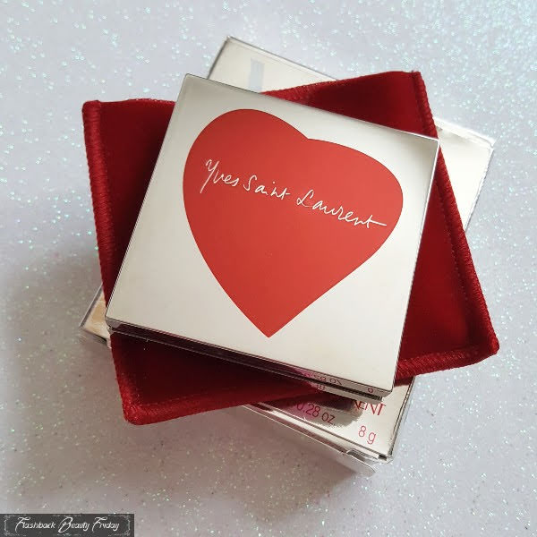 mirrored silver compact with red heart and Yves Saint Laurent logo on red velvet pouch and silver box