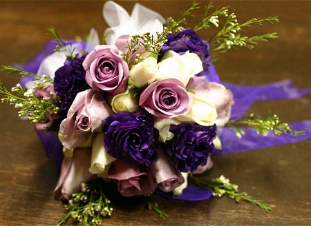 Four wedding floral bouquets using shades of purple as the main source of 