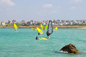 windsurfers, cityscape,ocean