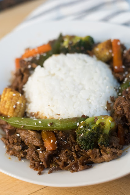 A plate of the Easy 16 Minute Beef Teriyaki Stir Fry around a mound of white rice