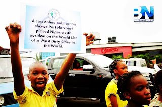 A pupil holding a banner