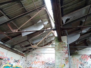 <img src="img_Bailey Mills, New Delph, Manchester Urbex.jpg" alt="Image of  ceiling inside workshop">