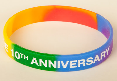 Rainbow wristband with 'Wakefield Pride 10th Anniversary' on in white letters