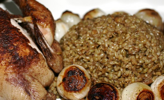 Roasted Freekeh ma’ djej and onions in a dish