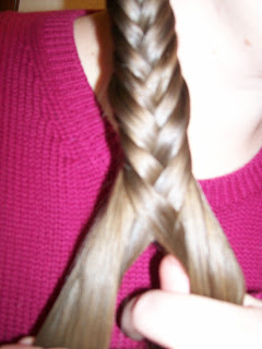 Braiding hair in "Grecian plaits".