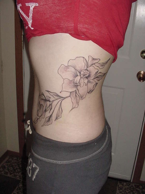 lower hip tattoo. tattoo on lower hip. lower hip