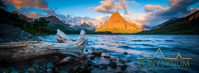 Sunrise on Sinopah Mountain, Waves from Two Medicine Lake crashing on the beach and into a stump, Glacier National Park