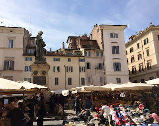 Vendors under their tents in Campo de' Fiori market, Rome, Lazio, Italy