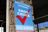 2A smog testing facility sign is shown marking a garage as a certified testing station for vehicles in Encinitas, California September 23, 2015. (Credit: Reuters/Mike Blake/File Photo) Click to Enlarge.