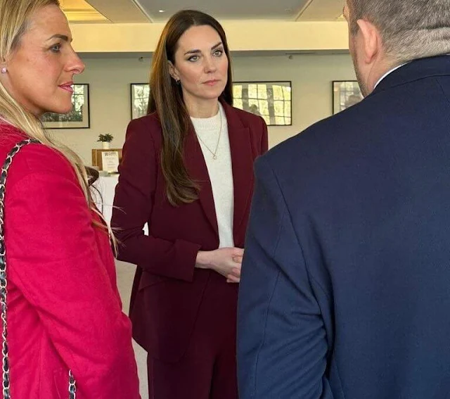 The Princess wore a wintery plum-colored power suit layered over a soft white knit and accessorised with matching heels and a gold necklace