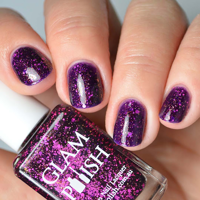 purple nail polish with pink glitter four finger swatch