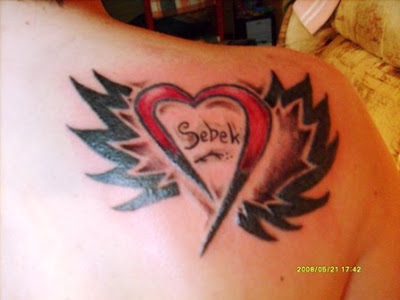 love heart tattoos with wings. love heart tattoos with wings.