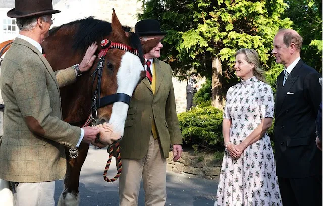 The Countess of Wessex wore a new bespoke floral print midi dress by Emilia Wickstead, and metallic fit-and-flare midi dress by Alaia