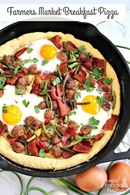 Brimming with bacon, pork sausage, & farm fresh eggs, this hearty Farmers Market Breakfast Pizza is sure to be a crowd-pleaser.