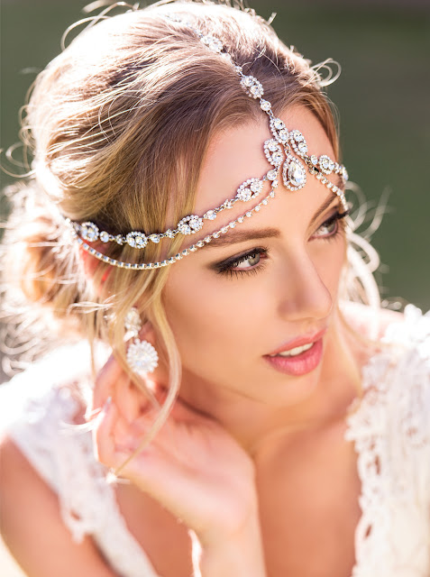 http://amyobridal.com/store/product/enchanted-crystal-tierd-headpiece/