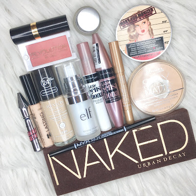 Revlon Lipstick, Make Up Revolution Blush, Maybelline Eyeliner, The Balm Highlighter, Benefit Brow Gel, Collection Concealer, Revlon Foundation, Elf Primer, Maybelline Lash Primer, Maybelline Mascara, Gosh Eyeshadow Crayon, Rimmel Powder, Nyx Brow Pencil, Urban Decay Eyeshadow Palette 