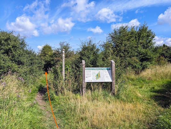 Walk past the sign and continue on Colney Heath footpath 14