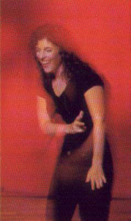 singer-poet Lisa B (Lisa Bernstein) laughs