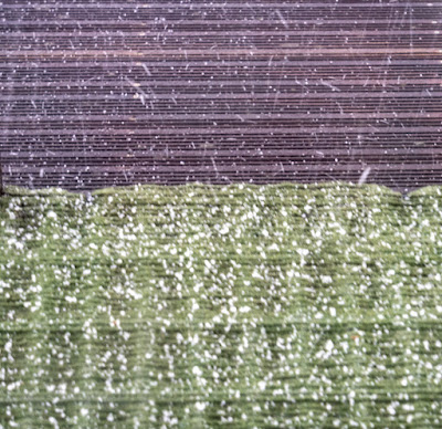 Photo of a closer view of the hailstones on our steps and the pontoon