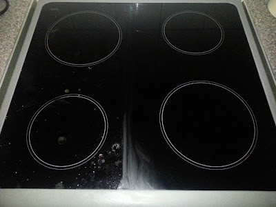 Hob half cleaned using EcoEgg Hard Surface Cleaner