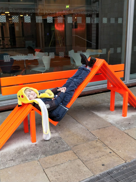 child with ASD on bench