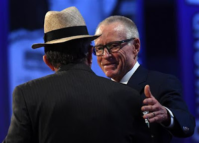Mark Martin reaches out to Jack Roush during his induction into the NASCAR Hall of Fame.