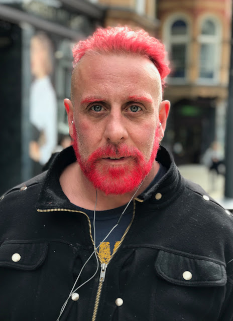 Man with pink beard and hair