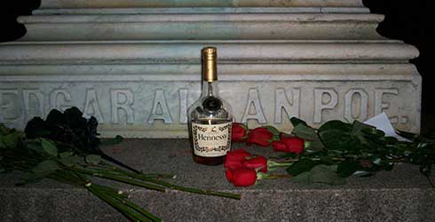 Roses and cognac on the grave of Poe