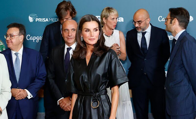Queen Letizia wore a black leather belted midi dress by & Other-stories