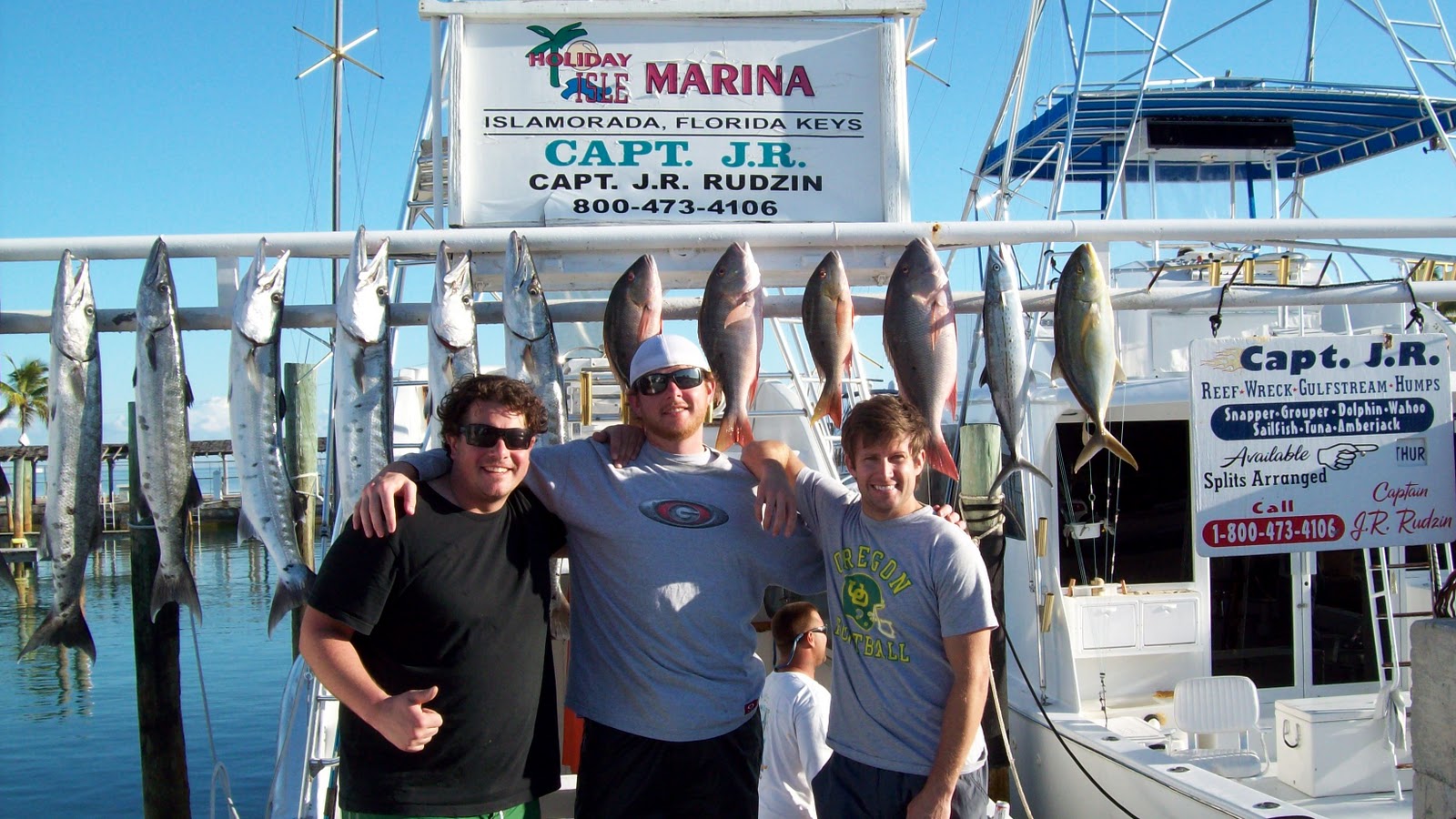 three young men with mutton snapper, a mackeral, yellow jack and plenty of cuda's 