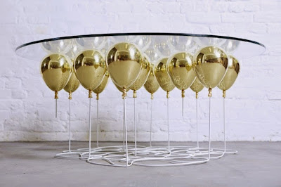 Design very creative glass table with golden balloons 