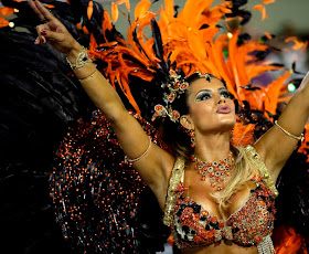 Drum queen Lucilene Caetano, from Inocentes de Belford Roxo samba school, dances during a carnival parade at the Sambadrome in Rio de Janeiro, Brazil, Sunday, Feb. 10, 2013. AP / Silvia Izquierdo.