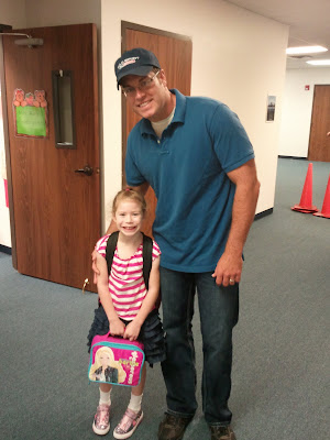 Celeste and Daddy standing outside her Kindergarten classroom