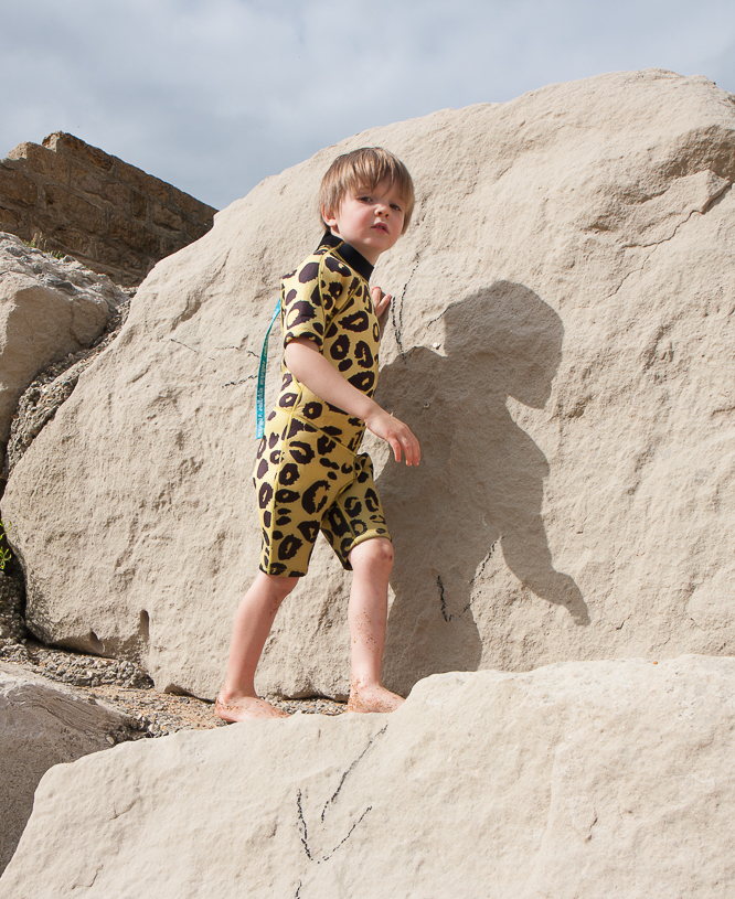 Henry wearing a leopard print wetsuit made by Saltskin