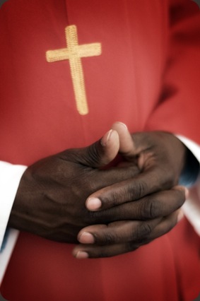 Lutheran priest with clasped hands before wedding - Joretha Taljaard Wedding Photography