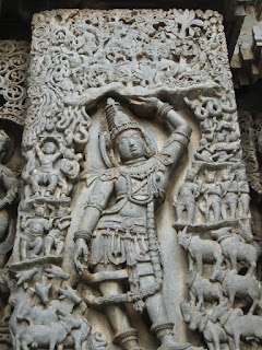 Krishna supporting mount Govardhana. Twelfth-century sculpture from the Temple of Kesava, Belur.