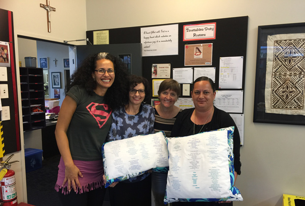 Selina with 3 St Joseph's staff holding poetry cushions