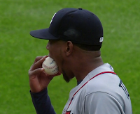 Julio Teheran bites baseball