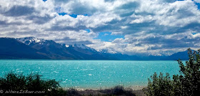 Mt. Cook in the distance, new zealand, panorama, lake, blue water, snow covered peaks,