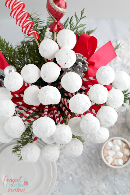 Create an easy & festive edible centerpiece for your holiday breakfast table with this Snowball Donut Hole Bouquet.