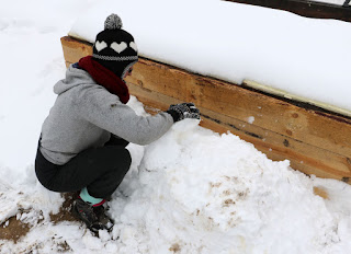 A gets started on her snow chair