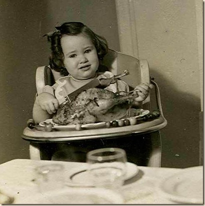 baby girl with roasted chichen all to herself