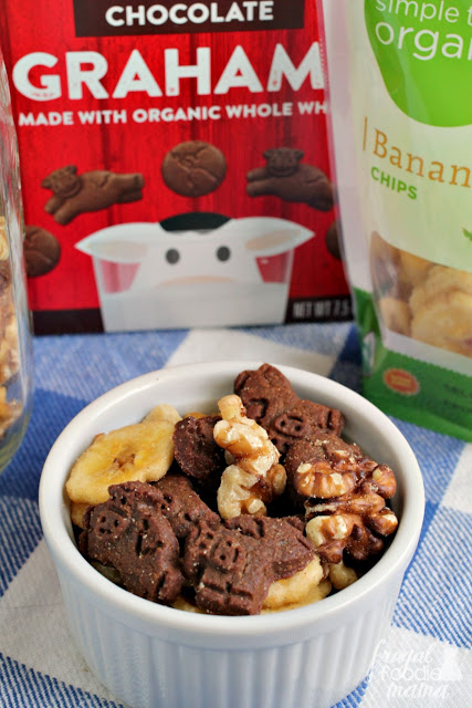 This Chunky Monkey Snack Mix is a crunchy mix of whole wheat chocolate grahams, organic banana chips, & satisfying walnuts. It is sure to quickly become a lunchbox & after school snack favorite.