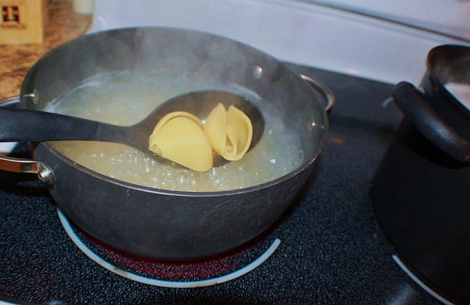 these are jumbo shells boiling in water with salt