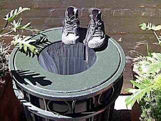 old shoes on a trash can - Old Pasadena CA