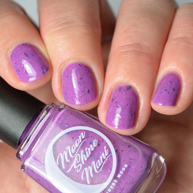 purple nail polish with flakies